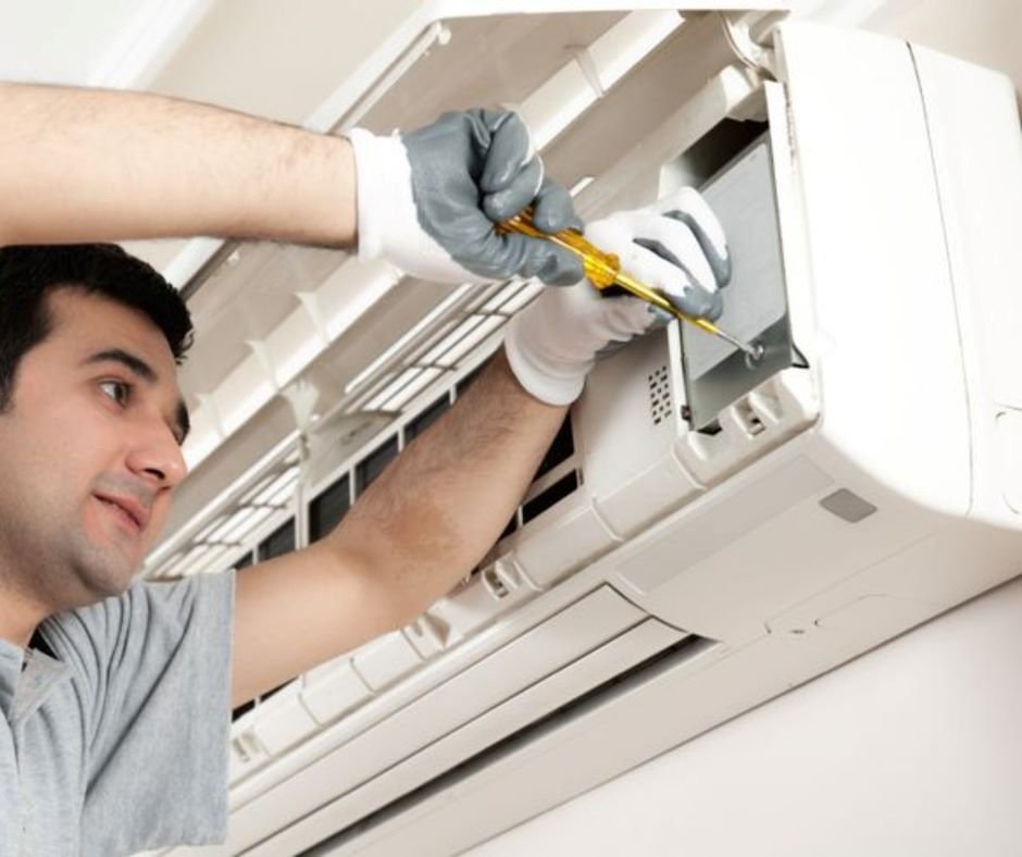 A technician at Albarq Service providing services for AC Installation in Muscat