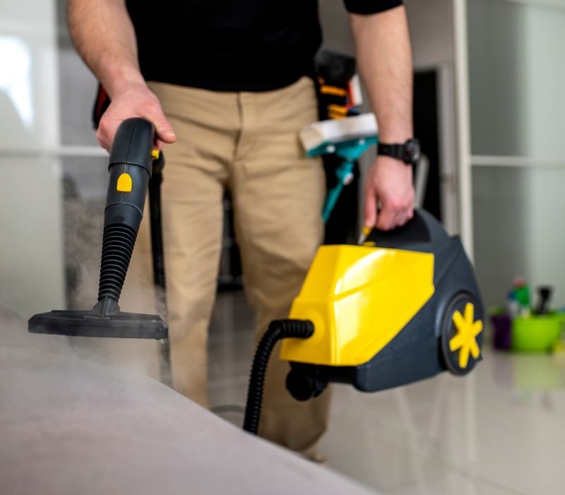 a boy doing apartment cleaning with vacuum